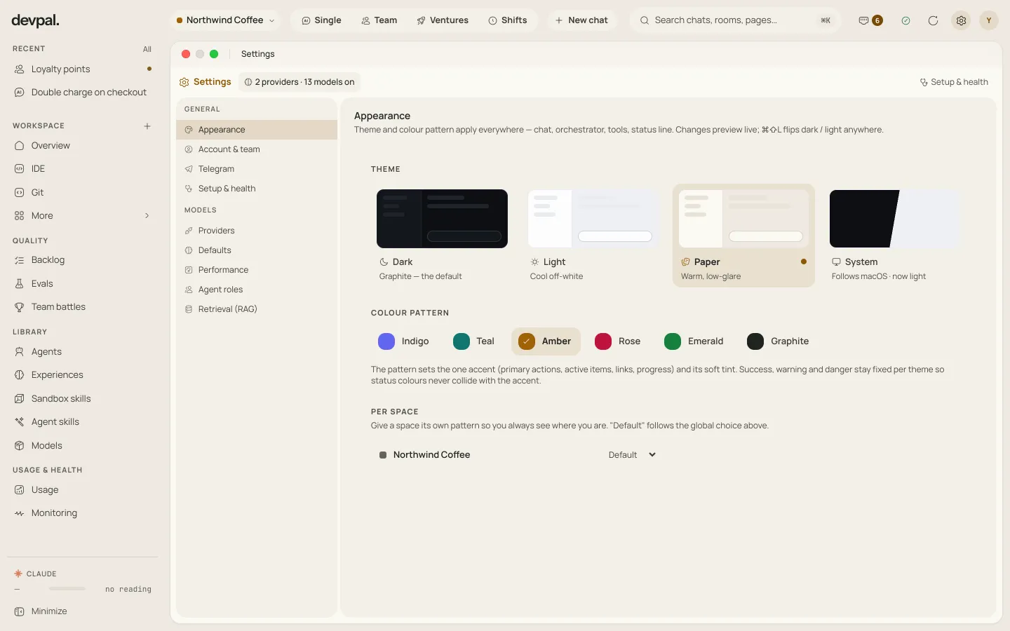 Settings, Appearance, in the warm paper theme with an amber accent: four themes, six colour patterns and a colour per workspace.